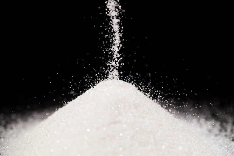 The sugar lies on the black background